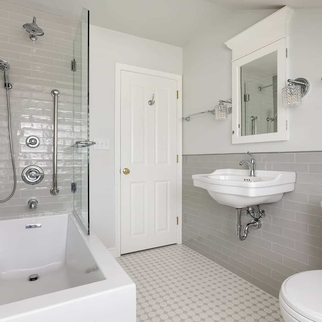 simple small white master bathroom with gray tile accents 