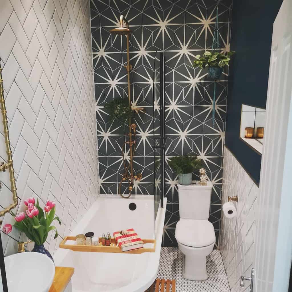 small white tile bathroom with small tub and feature wall