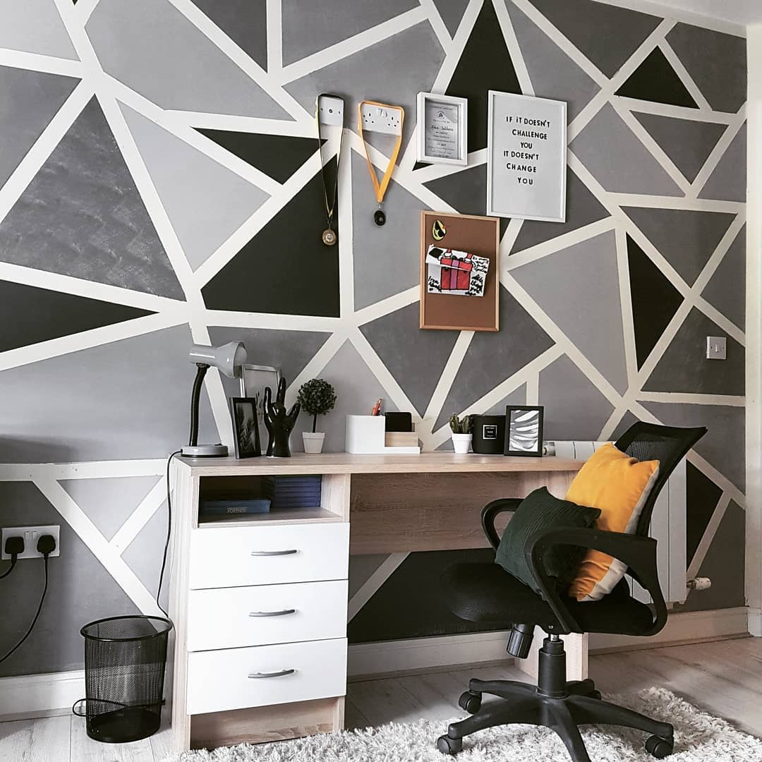 black and gray geometric shape painted feature wall in office 