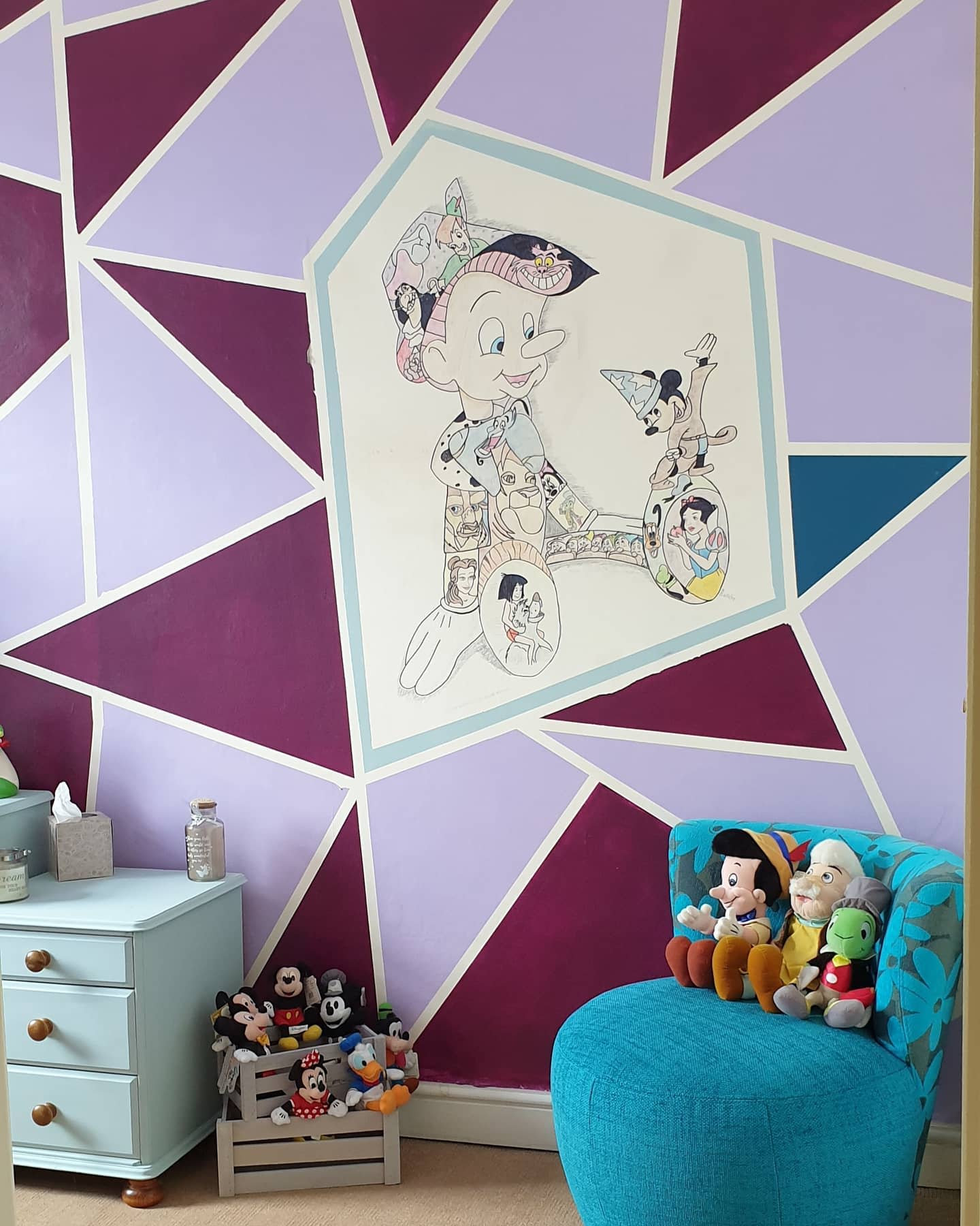kids bedroom with geometric accent wall and disney character mural 