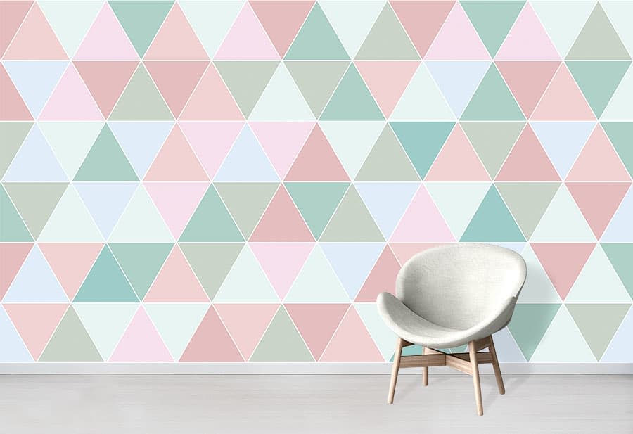 pastel geometric accent wall small white chair 