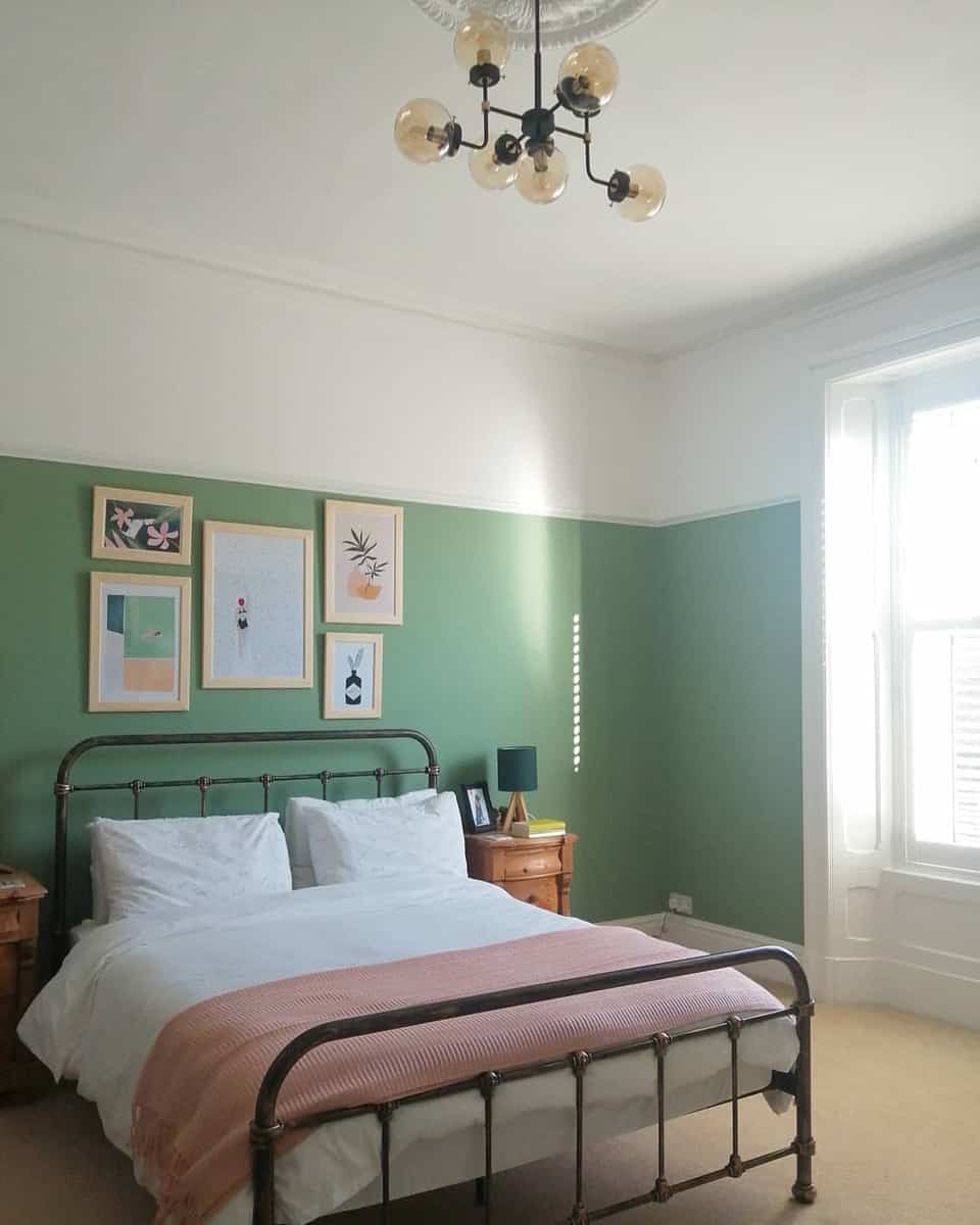 minimalistic green bedroom vintage bed frame framed wall art sputnik chandelier