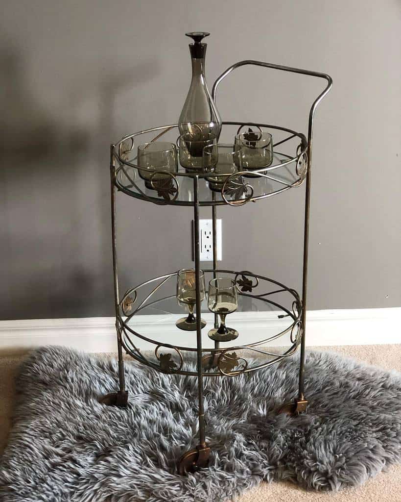 bar cart with decanter and glasses