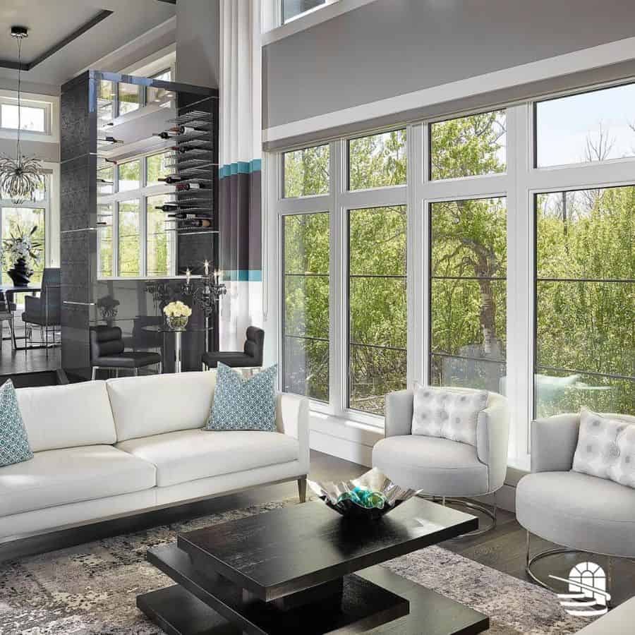 luxury living room white sofa two gray lounge chairs black wood coffee table 