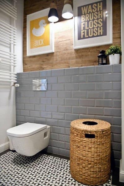 modern toilet with wicker clothes bin