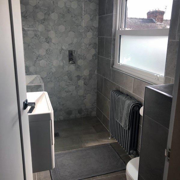 grey small master bathroom with frosted glass window 