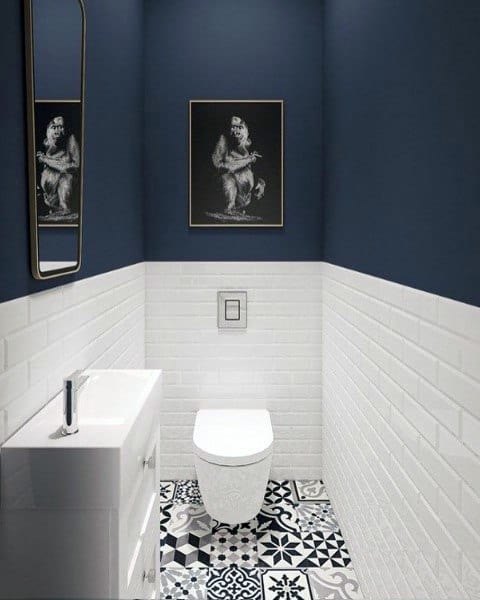 two tone blue wall and white tile narrow powder room