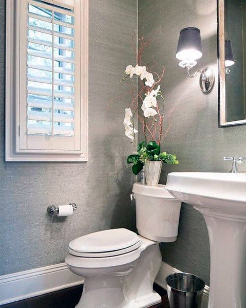 small powder room with gray wallpaper