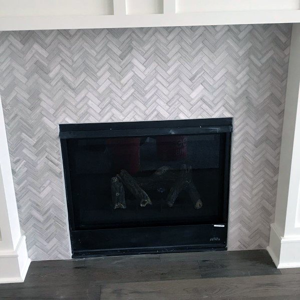 herringbone-patterned fireplace tiles