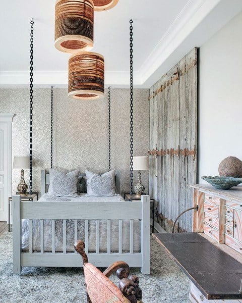 rustic bedroom four post bed with chains gray carpet