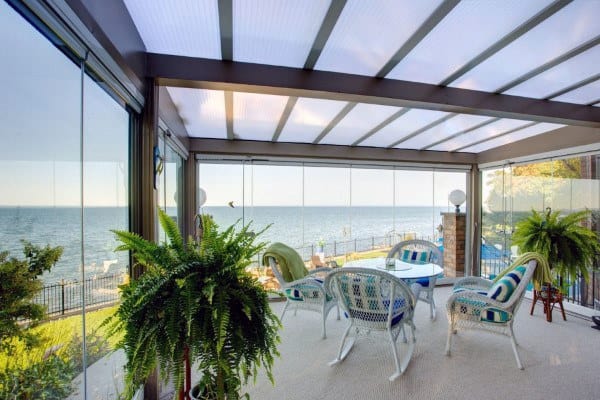 glass walls and ceiling sunroom ocean views