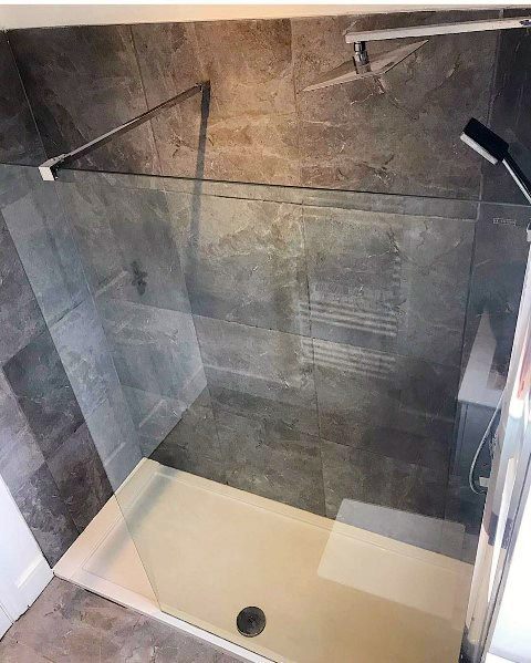 small gray shower with glass