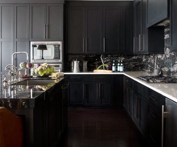 all-black kitchen with polished granite splashback