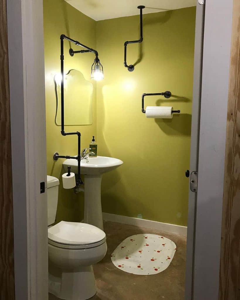industrial style bathroom with pipes