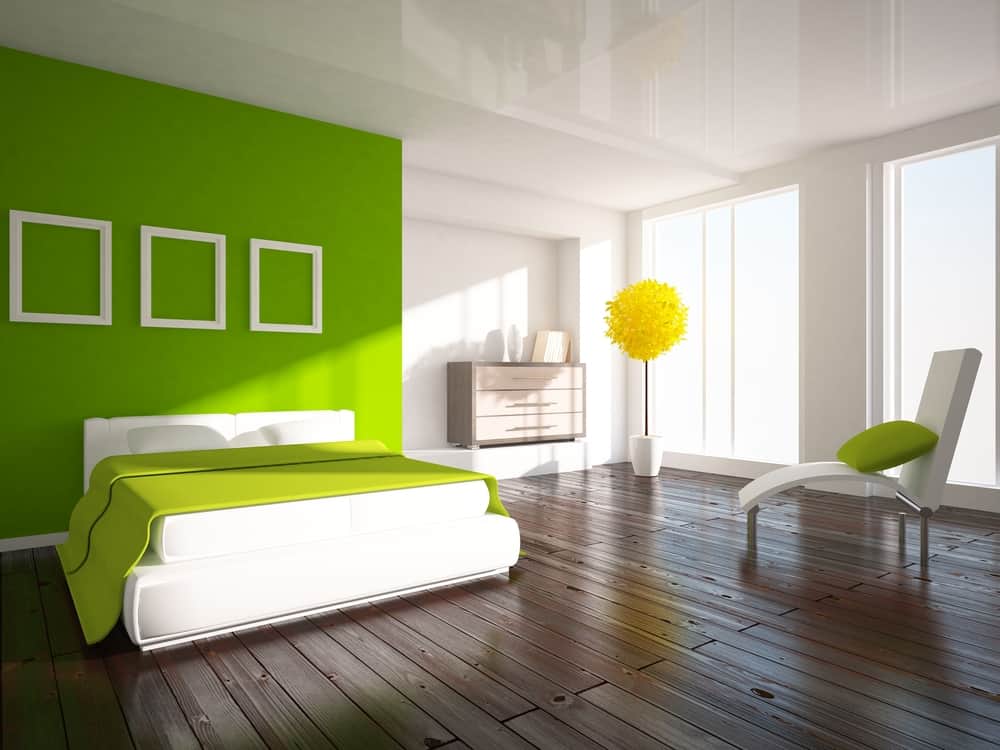 bright green feature art work white bed frame and label 