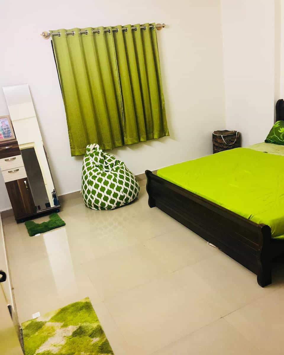 simple lime green curtains and bedspread beanbag tile floor