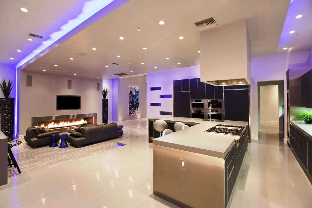 led roof lights luxury apartment fireplace open plan kitchen living area empty corner of the bedroom