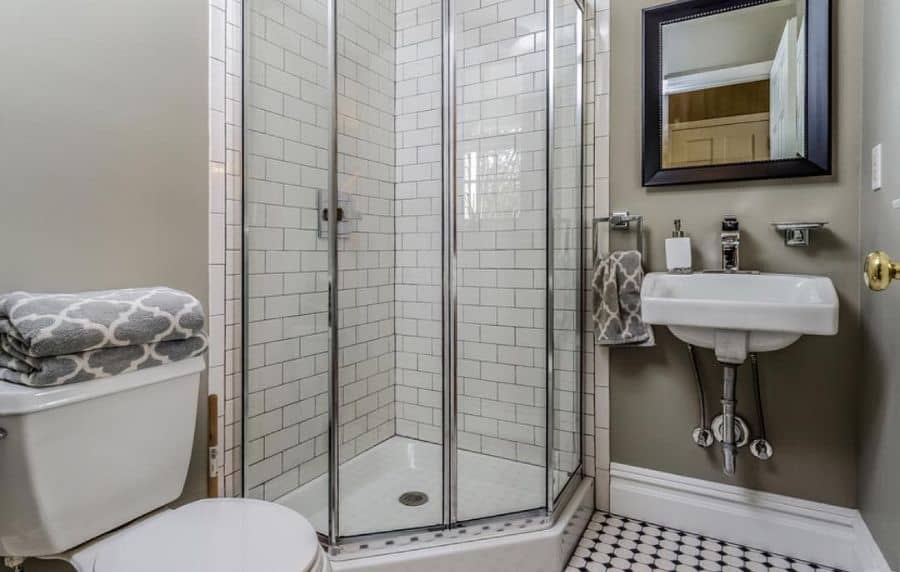 corner shower with white tiles 