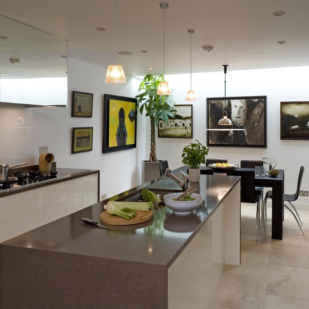 modern kitchen and dinning space with wall art