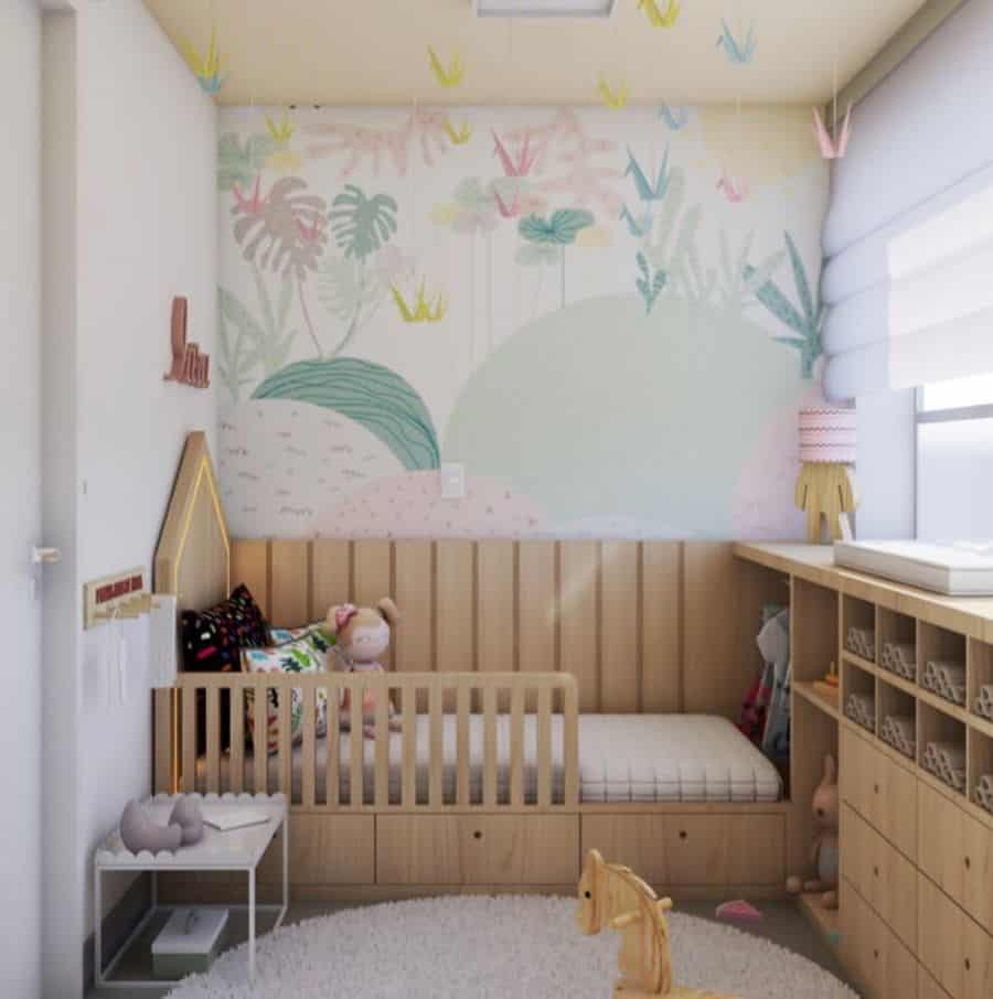 colorful pastel kids room wall mural wood bed and cabinets 