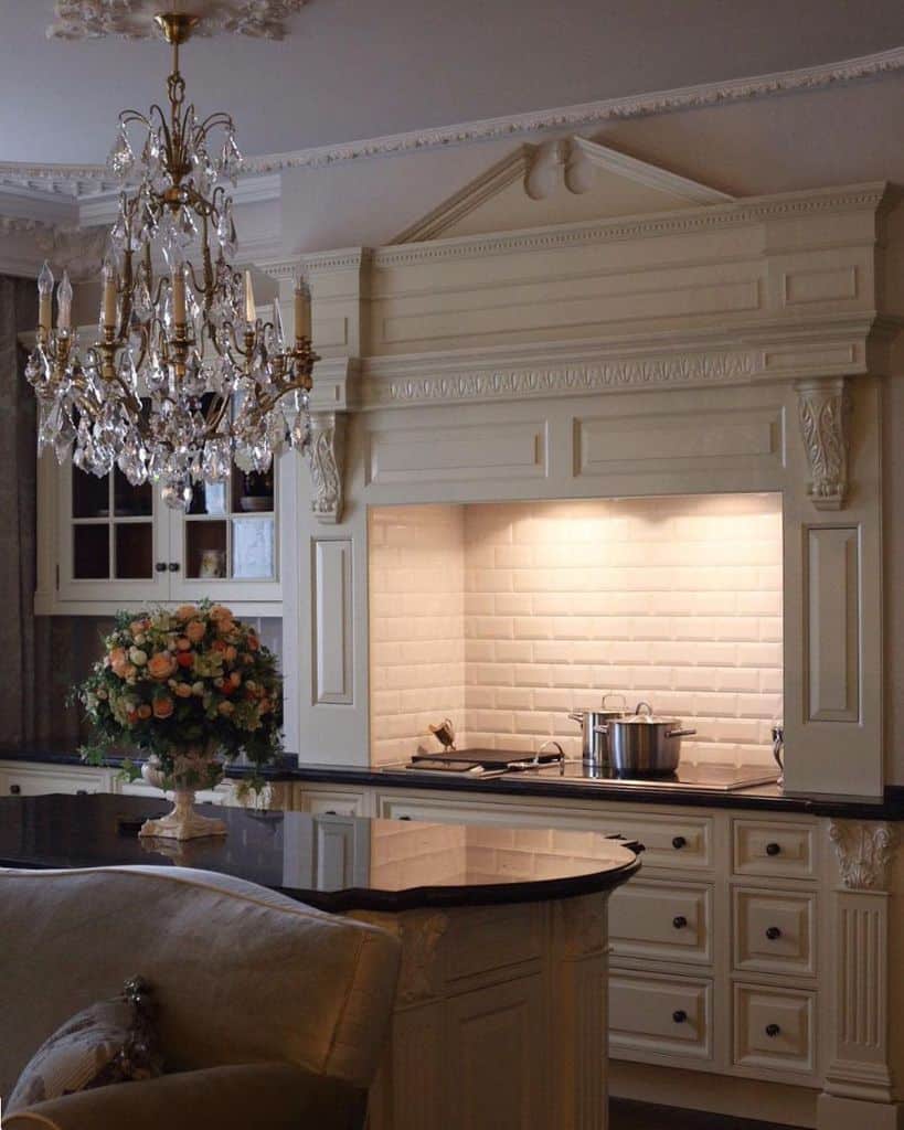 elegant kitchen hood white brick splashback chandelier