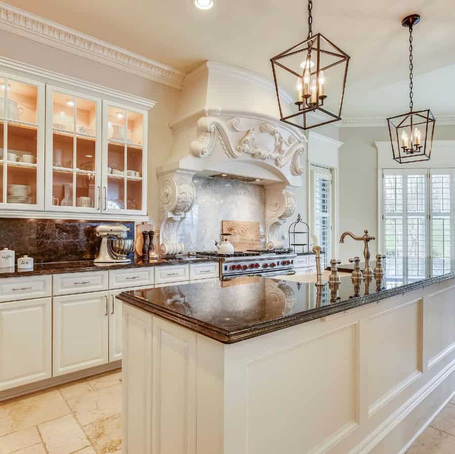 ornate kitchen hood french country kitchen white cabinets pendant lights 