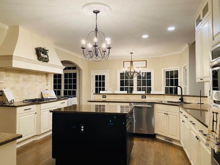 large french kitchen white cabinets black accents chandeliers