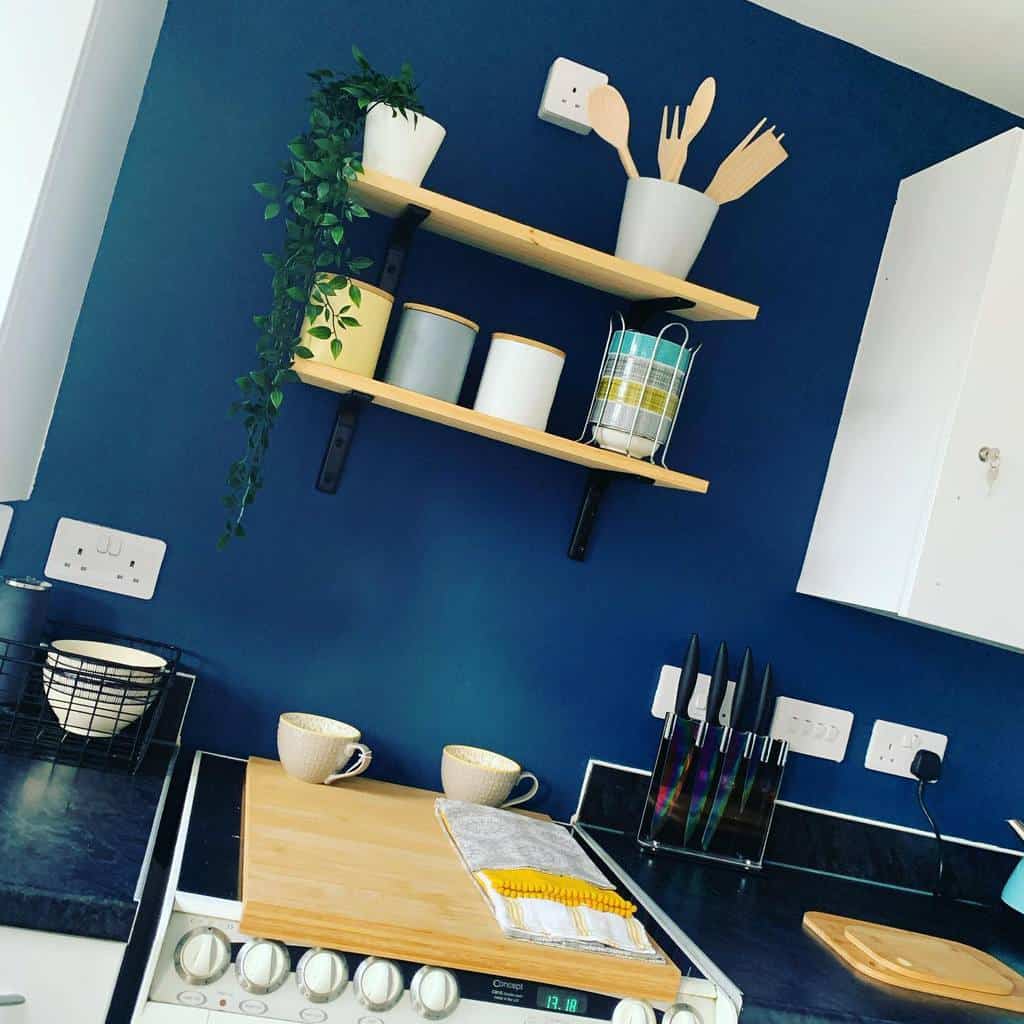 blue accent wall modern kitchen wood wall shelves