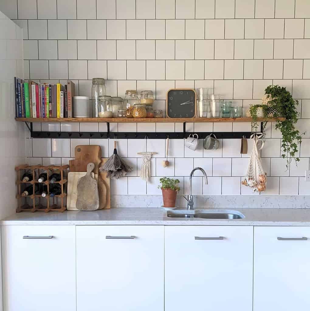 small kitchen white tile wall wood shelf 