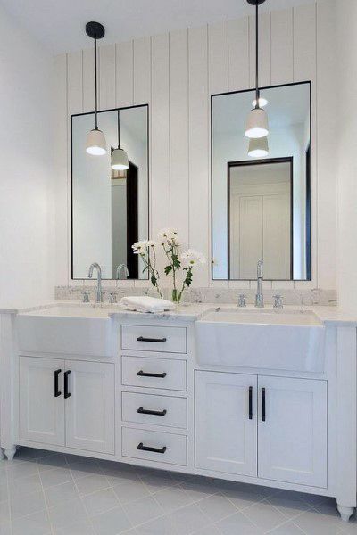 modern white bathroom dual mirrors black accents 