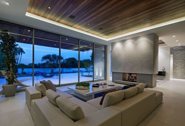 modern living room fireplace sofa ceiling to floor windows