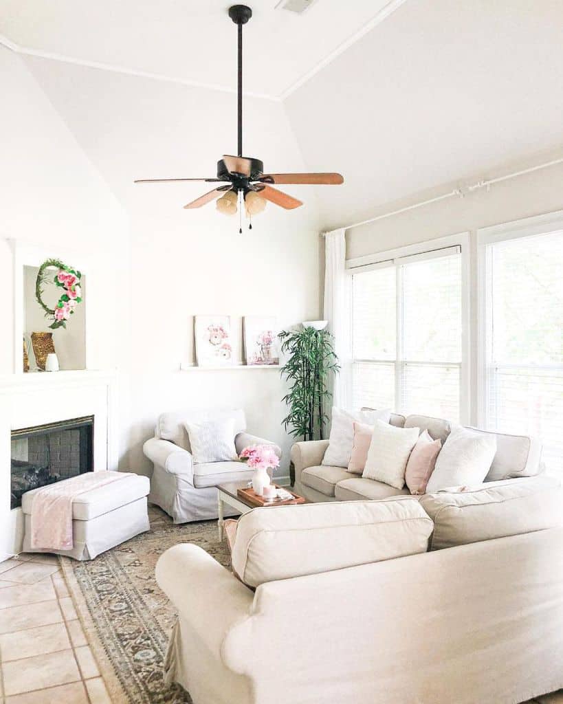 light country white living room two sofas ceiling fan fireplace 