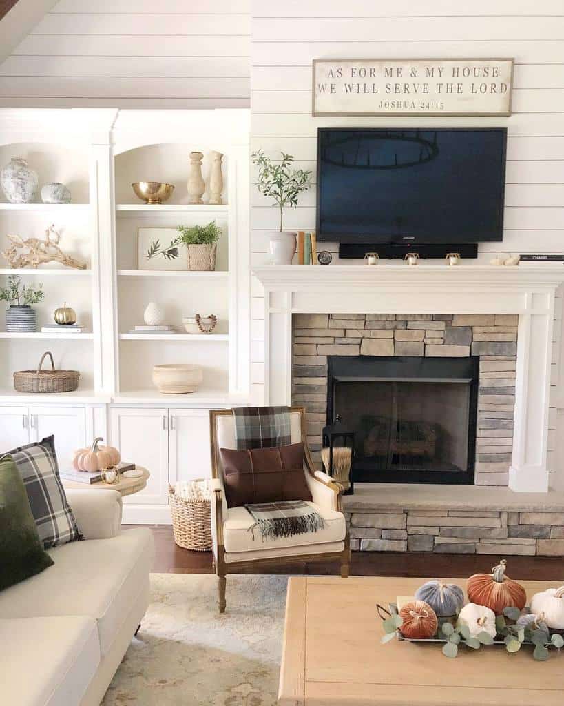 white shiplap living room stone fireplace cabinet wall mounted tv white sofa 