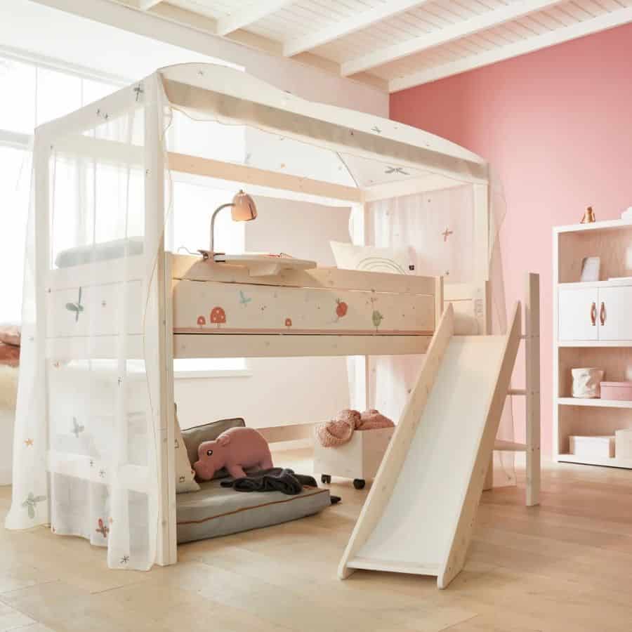 pink wall bedroom kids loft bed slide white cabinet 