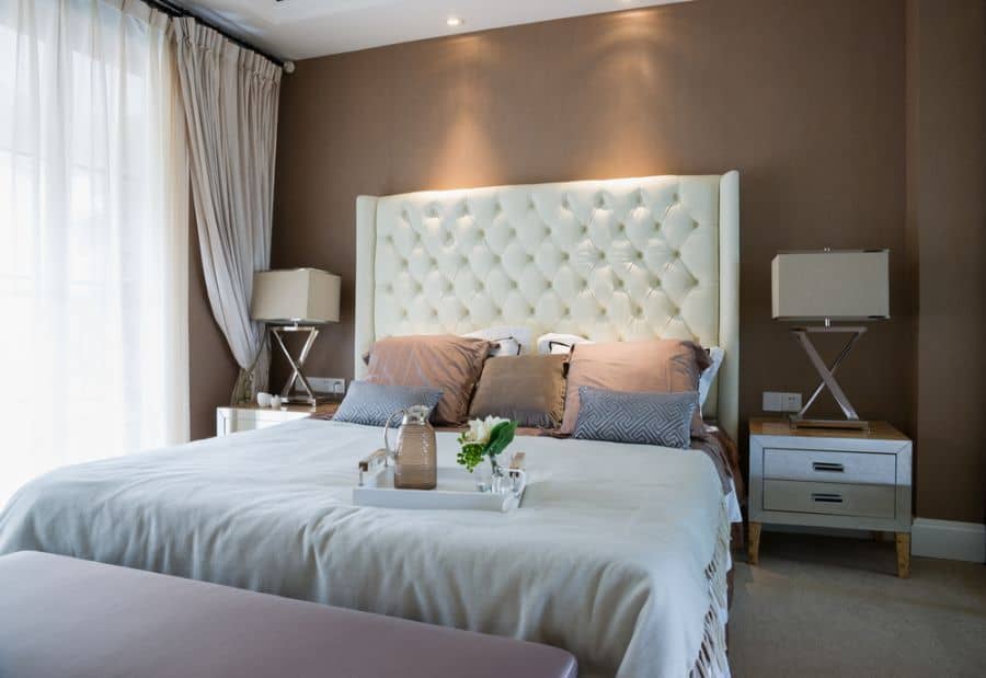 luxury hotel bedroom brown feature wall
