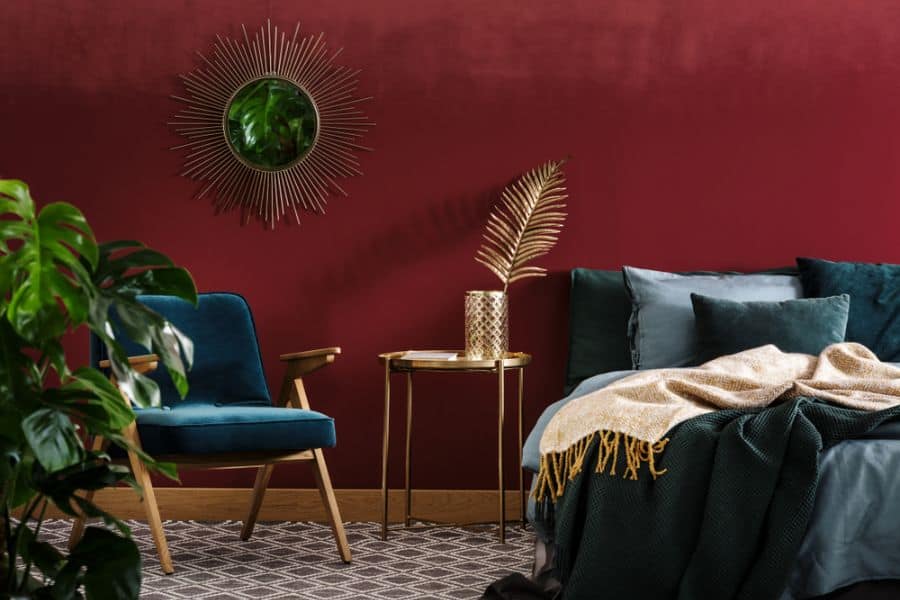 luxury bedroom red wall gold table blue chair