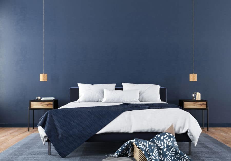 modern blue bedroom low hanging lights large rug