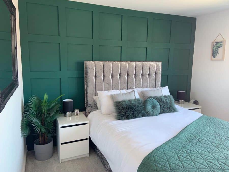 luxury green bedroom white bedside tables plants