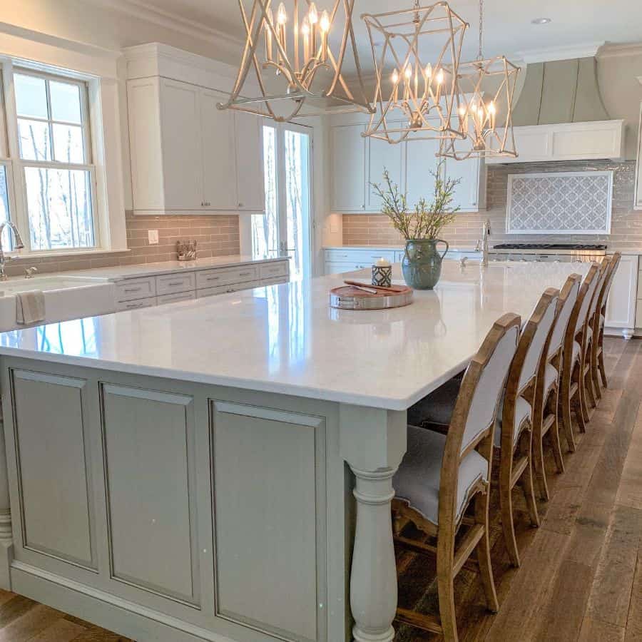 luxury elegant kitchen large white granite bar island chandelier