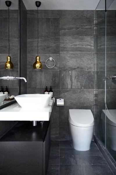 luxury modern bathroom with gray tiles and gold pendant lighting 
