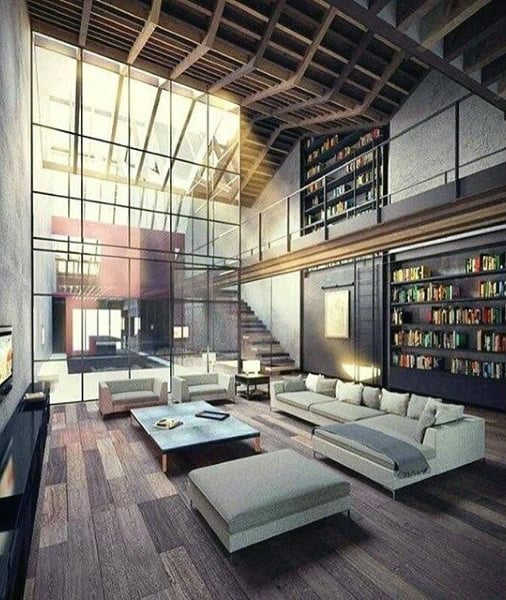large modern living room gray couch bookshelf 