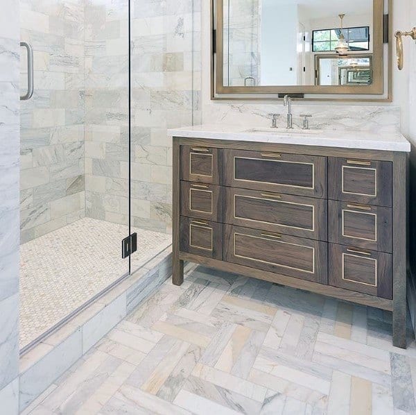 chervron pattern floor tile bathroom brown cabinet