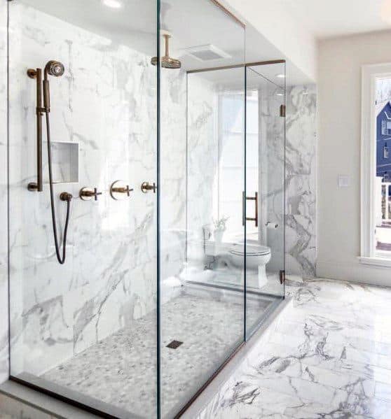 marble walls and tile floor master bathroom