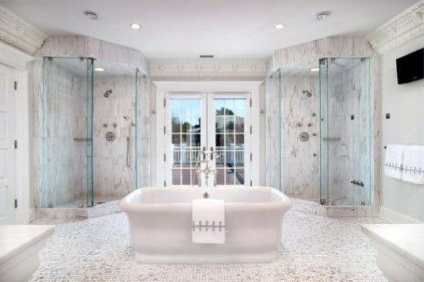 master bathroom with double showers and white bathtub 