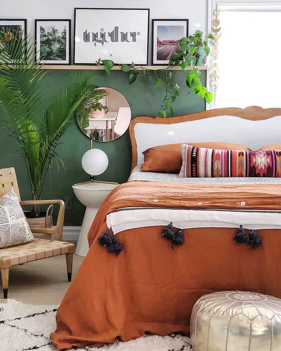 bedroom green accent wall wood wall shelf mirror mexican style bedspread 