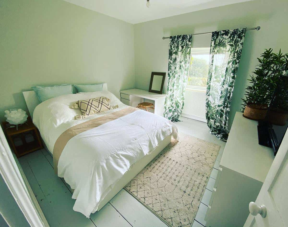 green master bedroom fern design curtains white bed floorboards 