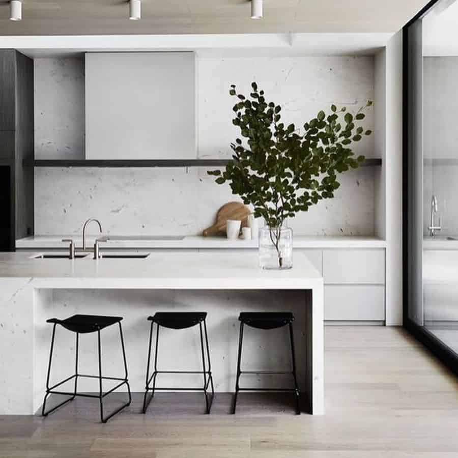 minimalist white kitchen bar with black stools 