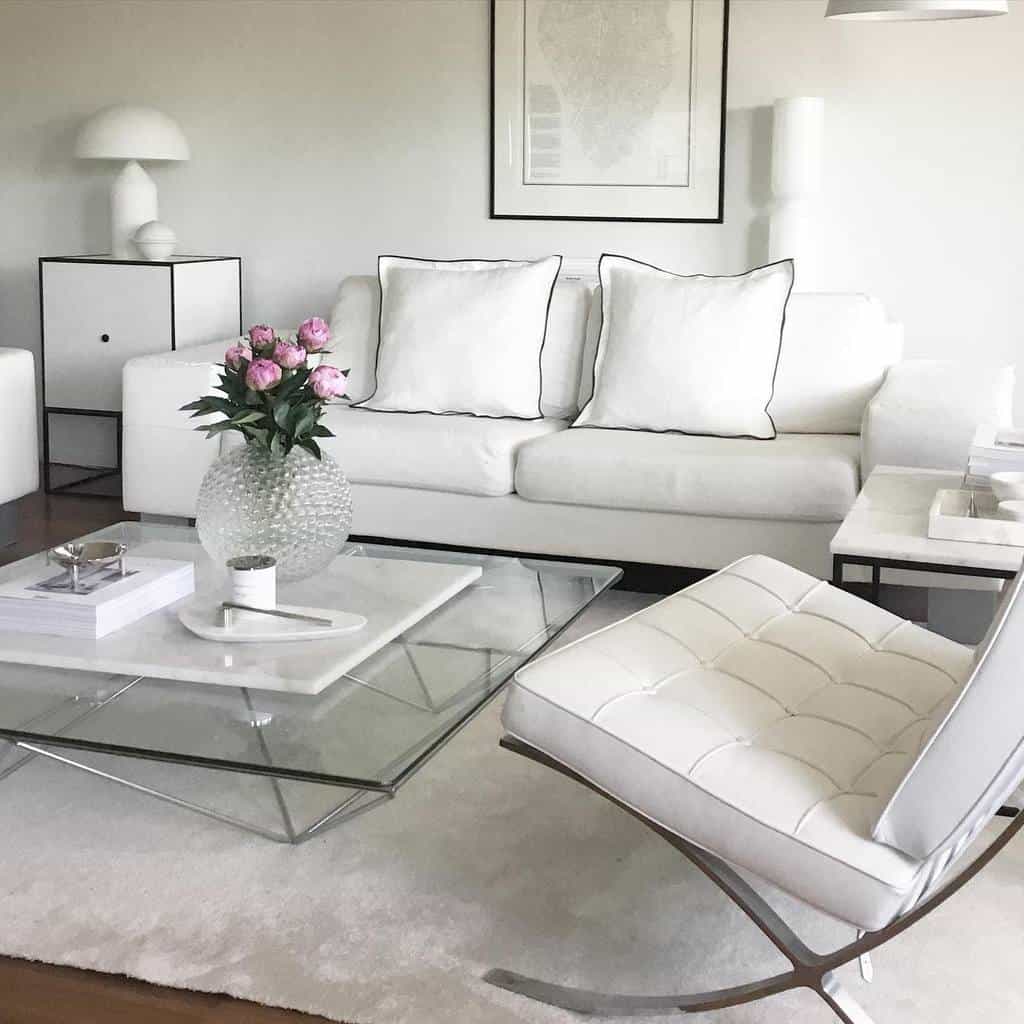 white sofa and framed post glass coffee table living space