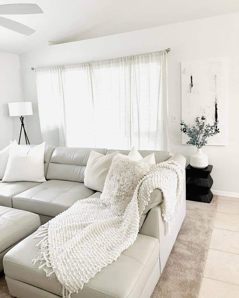 minimalist white living room gray sofa white vase 