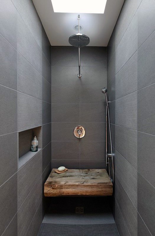 large grey tile shower wood bench